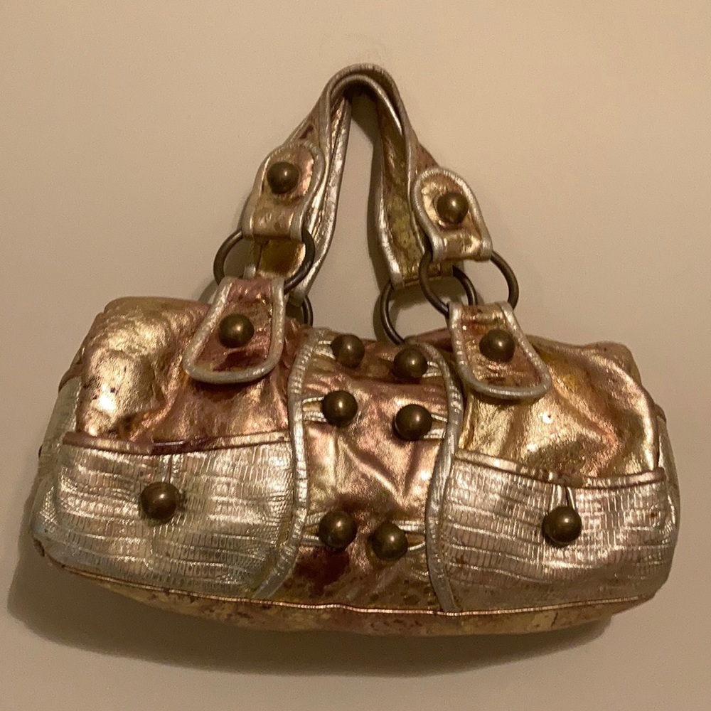 Gold purse by Betsy Johnson with brass hardware